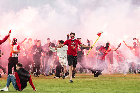 Slavia Prague fans invade the pitch after derby win