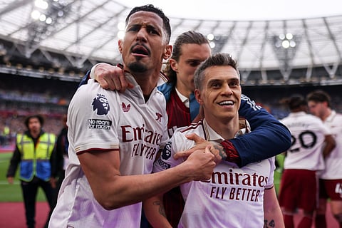 Leandro Trossard celebrates the winning goal with teammates