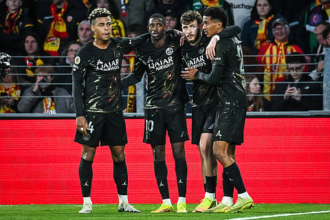 Paris St Germain players celebrate their goal against RC Lens