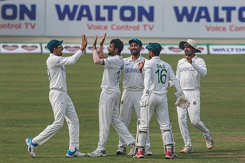 Bangladesh players celebrate a wicket