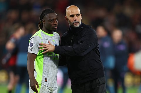 Pep Guardiola with Jeremy Doku at full time against AFC Bournemouth