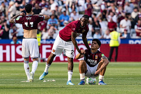 West Ham United players look dejected after getting relegated from the Premier League