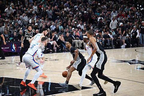 Oklahoma City Thunder and San Antonio Spurs players in action