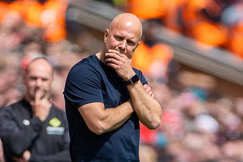 Arne Slot standing on the touchline