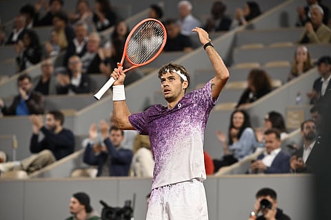 Flavio Cobolli celebrates his win over Felix Auger-Aliassime