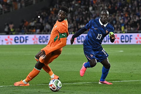France and Ivory Coast players in action