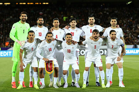 Iran players pose for a team photo