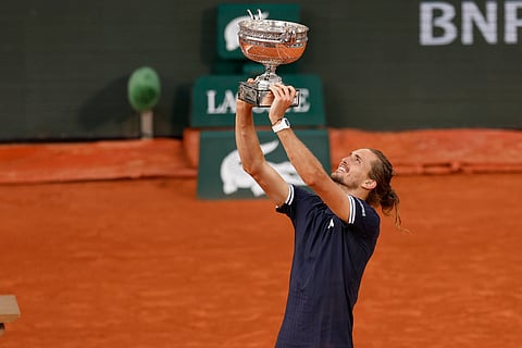 Alexander Zverev poses with the French Open title