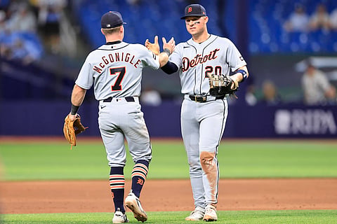 Detroit Tigers players congratulate each other after a win
