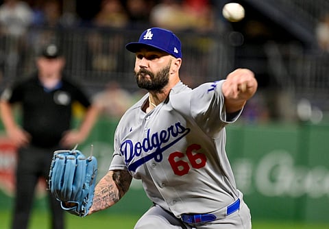 Los Angeles Dodgers pitcher Tanner Scott in action against Pirates