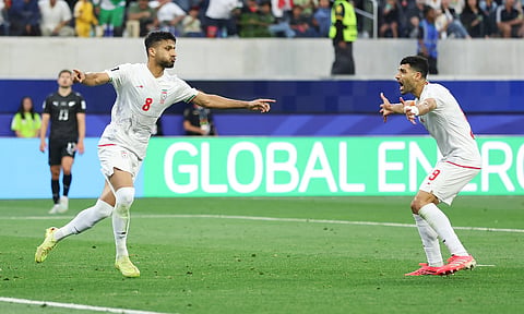Mohammad Mohebbi celebrates his equalising goal against New Zealand
