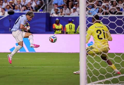 Maximiliano Araujo scores the equalizing goal for Uruguay