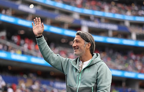 Murat Yakin waves to the fans at full time against Bosnia and Herzegovina
