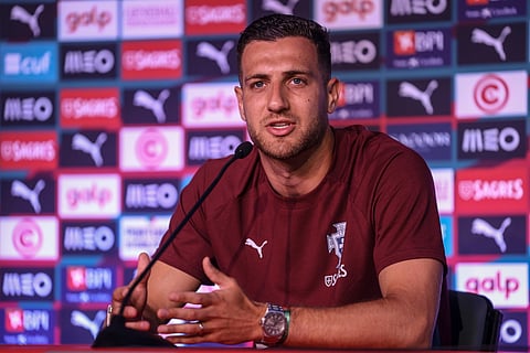 Diogo Dalot attends a press conference