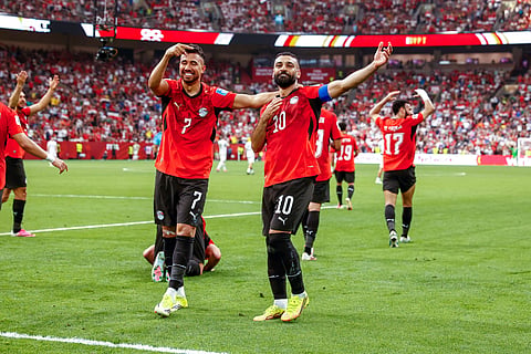 Mohamed Salah celebrates his goal with Mahmoud Trezeguet