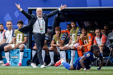 Graham Arnold reacts from the touchline against France