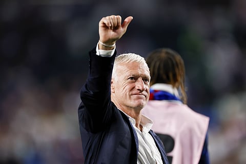 Didier Deschamps gives a thumbs up to the fans after win over Iraq