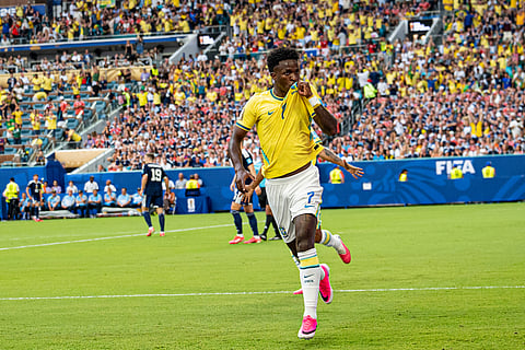 Vinicius Jr celebrates after scoring the opening goal for Brazil 