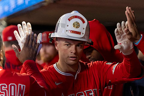 Logan O'Hoppe of Los Angeles Angels celebrates in the dugout 