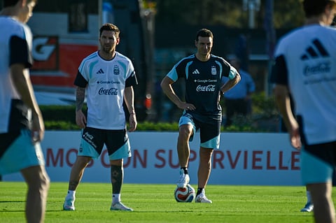 Lionel Messi with coach Lionel Scaloni during training session