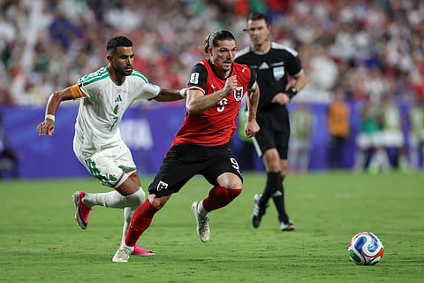 Austria and Algeria players in action 