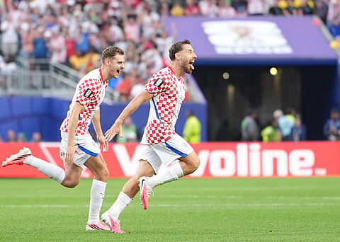 Nikola Vlasic celebrates after scoring the winning goal against Ghana