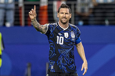 Lionel Messi celebrates after scoring against Jordan
