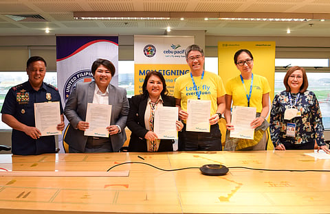 MOU. Officials from Cebu Pacific, United Filipino Global, Department of Migrant Workers, Overseas Workers Welfare Administration, and Philippine National Police pose for a photo after the MOU signing. From left, Police Lieutenant General Rhodel Sermonia, Deputy Chief Administrator of the Philippine National Police; Atty. Patricia Yvonne Caunan, Undersecretary of the Department of Migrant Workers; Gemma Sotto, President of United Filipino Global; Xander Lao, CEB President and Chief Commercial Officer; Candice Iyog, CEB Chief Marketing and Customer Experience Officer; Director Rosalia Catapang of the Overseas Workers Welfare Administration.