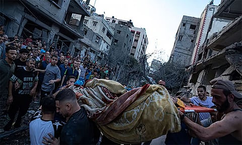 GAZA CITY. Palestinians rescue a man from the rubble of a destroyed residential building following an Israeli airstrike, Tuesday, October 10, 2023.