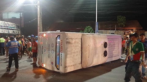 OVERTURNED. Shown in the photo is the unit of modern jeepney company KTTS Corp., also known as Kats, that overturned along the Cebu North Road in Barangay Basak, Mandaue City on Tuesday evening, Nov. 14, 2023. 