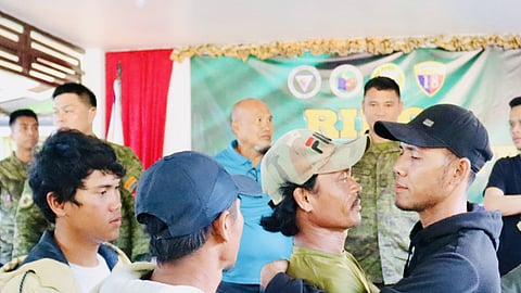 ZAMBOANGA. Four feuding families sign peace pacts on Saturday, December 16, ending their long-standing disputes in Basilan province. A photo handout shows two of the protagonists embraced as the looked at each other eye to eye during the signing of the peace pact at the headquarters of the 101st Infantry Brigade in Tabiawan, Isabela City, Basilan. 