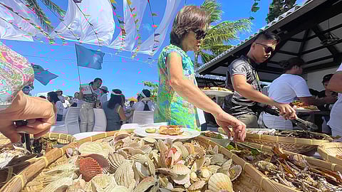 CEBU. Tourists savor a wide selection of food choices, including the famous danggit, while enjoying the picturesque view of the crystal clear waters fronting the Suroy Suroy Sugbo venue in the island municipality of Santa Fe, Cebu.