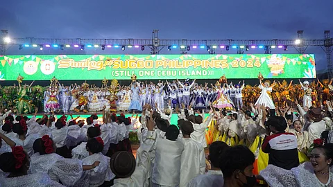 STILL ONE CEBU ISLAND. Contingents of the Sinulog sa Dakbayan 2024 share the stage after their ritual showdown performance at the Cebu City Sports Center on Jan. 13, 2024. / HEXTER ZERDA 