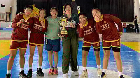 WE ARE THE CHAMPIONS. The University of Mindanao (UM)-A Lady Wildcats, coached by veteran  Crisanthemum “Ining” Sarabia, wins the women's 3x3 championship trophy in the National University Games (Uni-Games) 2024 basketball competition at the Jose Rizal Memorial State University (JRMSU) on Tuesday, January 23, 2024. UM-A defeated Polytechnic University of the Philippines (PUP)-A, 15-13, in their gold medal match. 