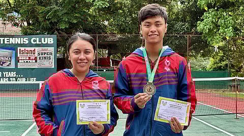 GOLDEN PERFORMANCE. Bemedaled netter Christian Nathaniel Angus of Mapua Malayan Colleges Mindanao (MMCM), right, lives up to his billing by winning the secondary boys' tennis gold medal for Unit 5 at the expense of Ananda Marga Special Academic Institution student Errol Daniel Giducos of Unit 8 in their championship match, 8-3, at the GSIS Heights Tennis Club on Friday, March 1.