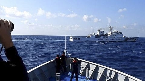MANILA. In this photo provided by the Philippine Coast Guard, a Chinese coast guard ship, top, tries to block a Philippine government vessel at the disputed South China Sea on Thursday, March 21, 2024.