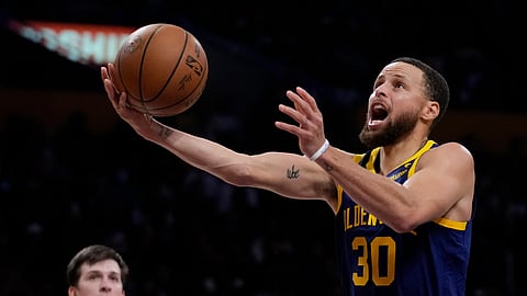 Curry out at least a week with quad injury