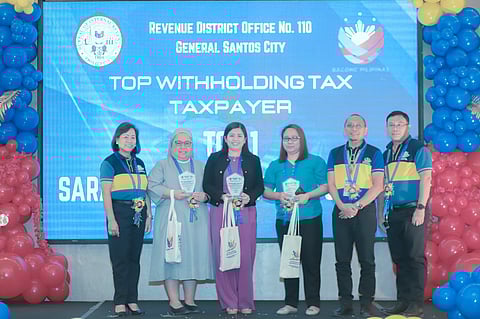  At the 2024 Tax Campaign Kickoff in General Santos City, Sarangani Energy Corporation's Plant Controller, Novie Sobrejuanite (3rd from left), received awards for Top Corporate Income Taxpayer, Top Value Added Tax (VAT) Taxpayer, and Top Withholding Tax Agent on behalf of the company, presented by OIC-Revenue District Officer, Atty. Sa'addudin Macarambon (2nd from right), and BIR Revenue Region 18 (RR18) Director, Christine Juliet Chua (extreme left).
