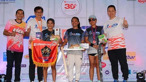 TOP THREE. Philippine National Games (PNG) 2023 triple gold medalist Lyka Catubig of Davao City, fourth from left, bags the women’s 21K championship trophy of the recently concluded Bukas Loob sa Dios (BLD) Run 2024 held in an out-and-back course from People's Park in Davao City.