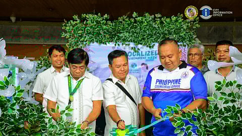 City Administrator Atty. Estefanio S. Libutan Jr. (left, center) and SP Member Armando L. Laguda Jr. (right,centere) cuts the ribbon during the opening of Localized Env't Week with CEMO Head CENRO1 Engr. Loreto C. Sanchez (center) and (back) Sr EMS Engr. Arthur A. Batomalaque and Sr. EMS Winston Alvarez and Brgy. Quezon PB Carlito T. Lazaga (rightmost)