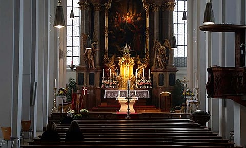 People wait for the beginning of an Easter Sunday Mass at the Church of the Holy Spirit 'Heilig Geist Kirche' in Munich, Germany, Sunday, April 4, 2021. Another 400,000 people formally left the Catholic Church in Germany last year, though the number was down from a record set in 2022 as church leaders struggle to put a long-running scandal over abuse by clergy behind them and tackle calls for reform, official figures showed Thursday, June 27, 2024. 