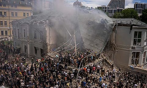 Emergency workers respond at the Okhmatdyt children's hospital hit by Russian missiles, in Kyiv, Ukraine, Monday, July 8, 2024. A major Russian missile attack across Ukraine on Monday killed at least 31 people and injured 154, officials said, with one striking a large children’s hospital in the capital of Kyiv, where emergency crews searched the rubble for victims. 