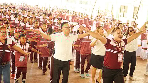 ENERGETIC SEND-OFF. Department of Education (DepEd) Davao regional director Allan Farnazo joins the fun of a dance exercise during the send-off of the Palarong Pambansa-bound Davao Region Athletic Association (Davraa) Eagles delegation at the Mintal Elementary School covered court on Tuesday morning, July 2, 2024.