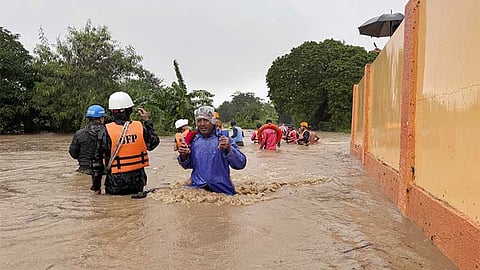 ILOCOS. Residents negotiate floods caused by powerful Typhoon Krathon locally called “Typhoon Julian” in Bacarra, Ilocos Norte province, northern Philippines on Monday, September 30, 2024.