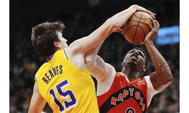 Raptors rout Mavericks as Barrett reaches milestone