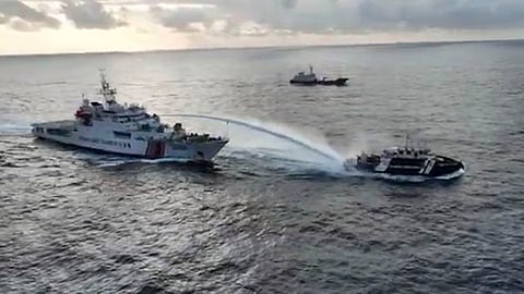 MANILA. In this image made from a video provided by the National Task Force for the West Philippine Sea (NTF-WPS), a Chinese coast guard vessel (left) fires a powerful water cannon on a Philippine bureau of fisheries vessel near a disputed shoal in the South China Sea Wednesday, December 4, 2024.