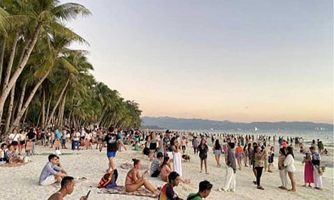 TOURISTS ARRIVAL. Thousands of tourists flock to Boracay Island in Malay, Aklan during the Holy Week of 2024. President Ferdinand R. Marcos Jr. signed on Monday (Dec. 9) Republic Act 12079 or the Value Added Tax Refund on Non-Resident Tourists Law which is expected to further attract foreign tourists. (Photo courtesy of Kimberly Pineda)
