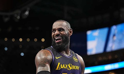 Los Angeles Lakers forward LeBron James (23) laughs on the court in the second half of an NBA basketball game against the Atlanta Hawks, Friday, Dec. 6, 2024, in Atlanta.