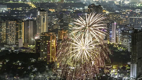 Fireworks illuminate the night sky over Cebu City as residents welcome the New Year 2025.  