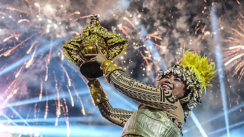CEBU. The festival queen of Lumad Basakanon raises the Blessed Sto. Niño as they clinch victory in both the street dancing and ritual showdown of the Sinulog sa Dakbayan 2025 on January 12, 2025.